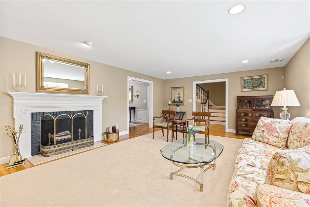 359 Grove Street Needham, MA 02492 - Photo 16 of 37 a living room with furniture a fireplace and a table