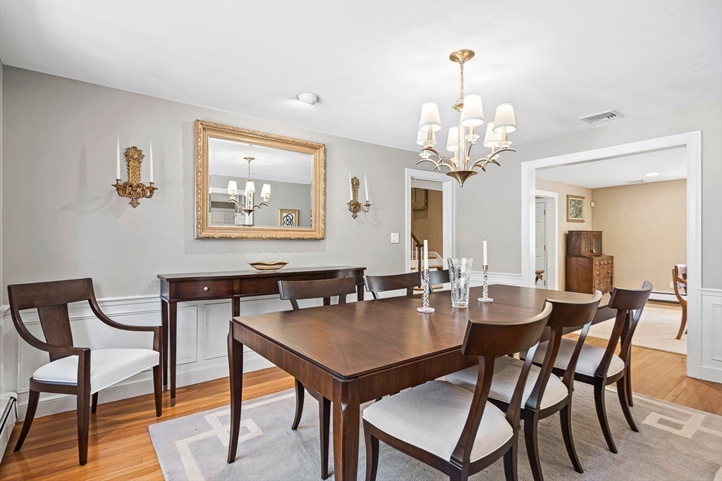 359 Grove Street Needham, MA 02492 - Photo 17 of 37 a view of a dining room with furniture and chandelier