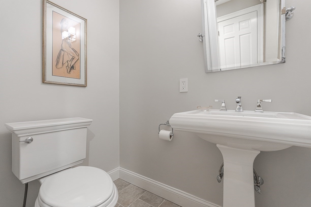 359 Grove Street Needham, MA 02492 - Photo 19 of 37 a bathroom with a sink mirror and toilet