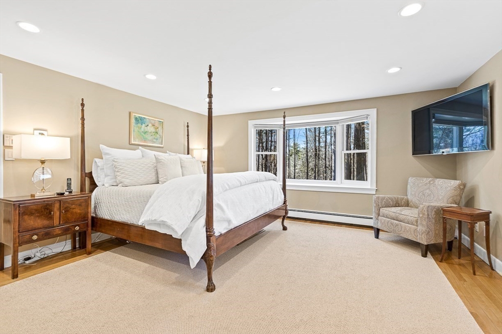 359 Grove Street Needham, MA 02492 - Photo 20 of 37 a bed room with a bed and a chair