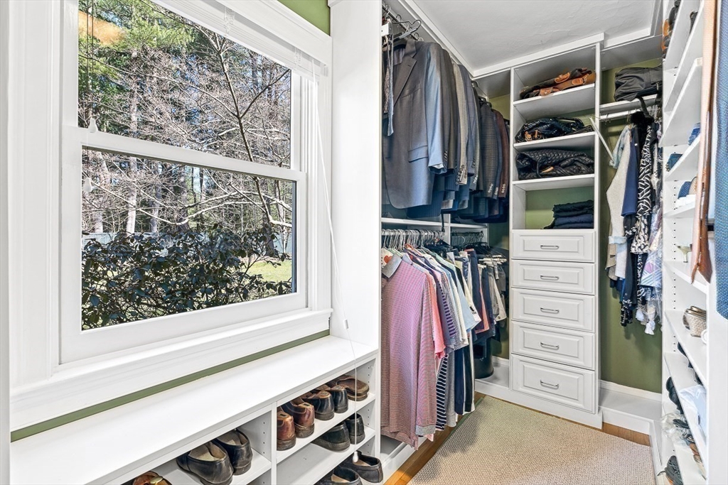 359 Grove Street Needham, MA 02492 - Photo 24 of 37 a view of walk in closet with clothes and shoes