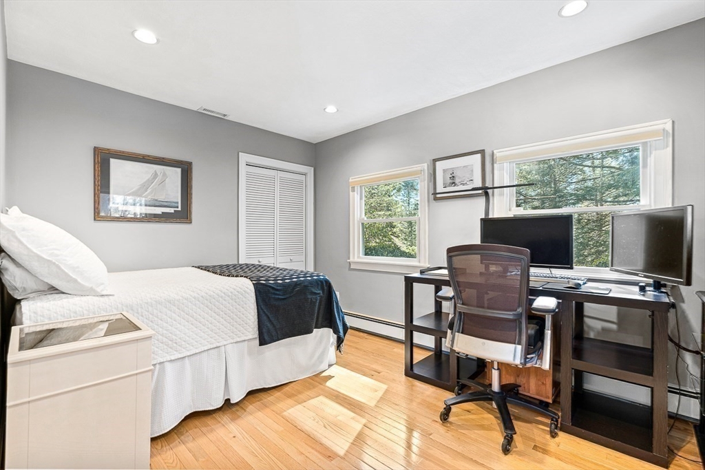 359 Grove Street Needham, MA 02492 - Photo 25 of 37 a bedroom with a bed and a desk