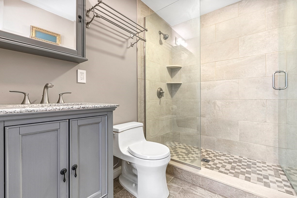 359 Grove Street Needham, MA 02492 - Photo 26 of 37 a bathroom with a sink toilet and shower