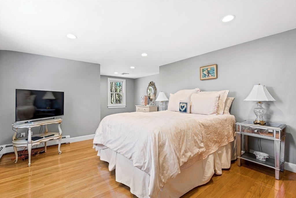 359 Grove Street Needham, MA 02492 - Photo 30 of 37 a bedroom with a bed and a flat screen tv