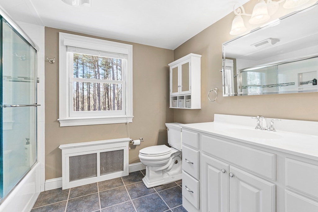 359 Grove Street Needham, MA 02492 - Photo 31 of 37 a bathroom with a sink toilet and window