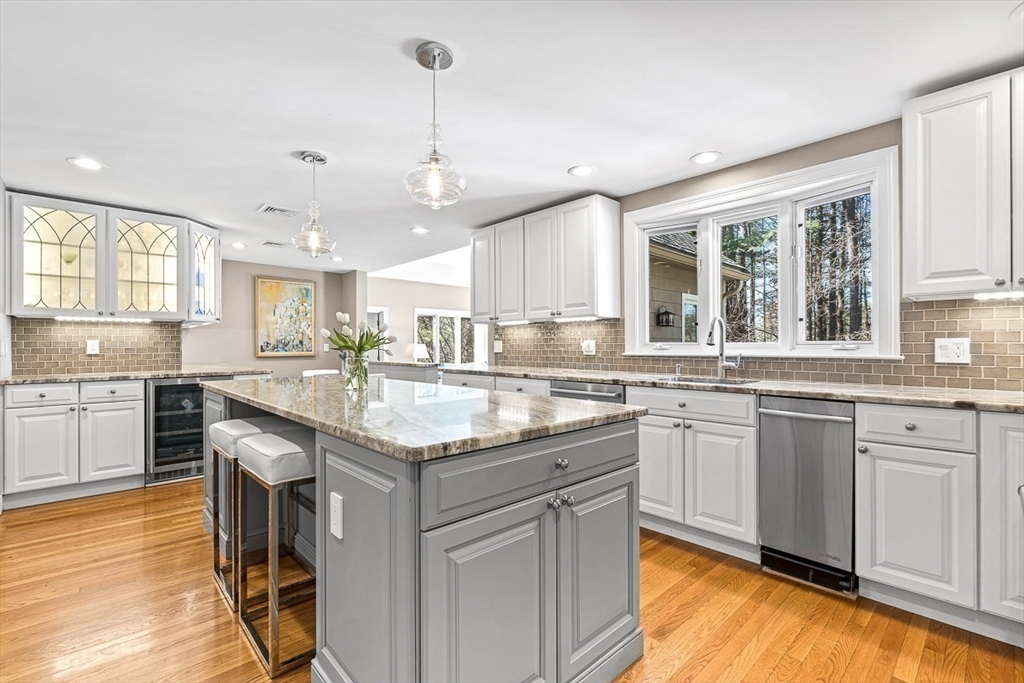 359 Grove Street Needham, MA 02492 - Photo 7 of 37 a kitchen with stainless steel appliances granite countertop stove top oven and cabinets