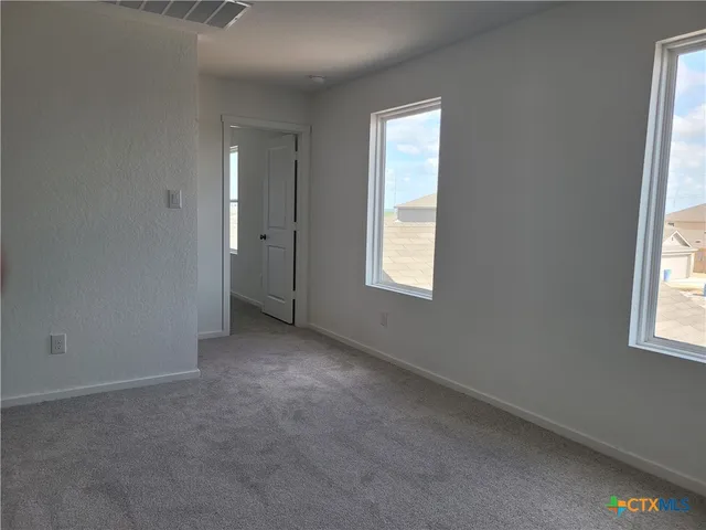 an empty room with windows