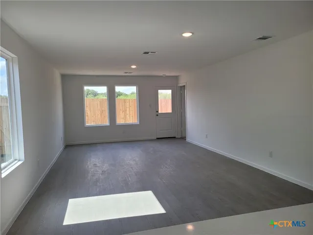 an empty room with windows