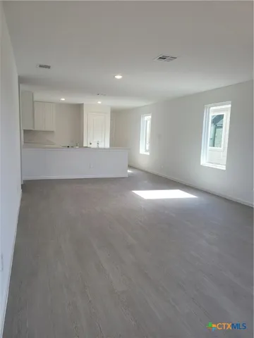 a view of empty room with windows