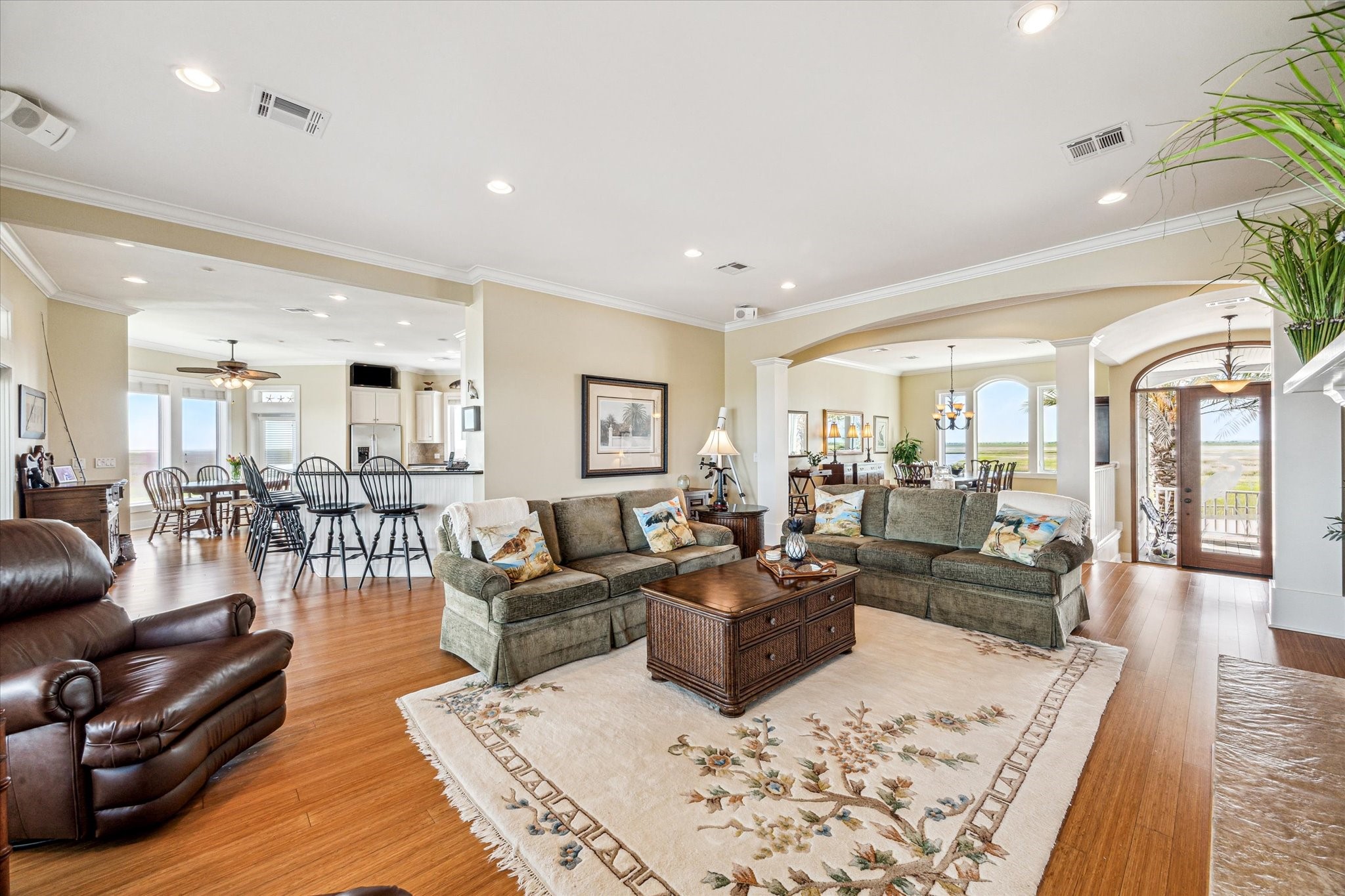 1 Shell Key Hitchcock, TX 77563 - Photo 14 of 50 A home filled with thoughtful extras that elevate both comfort and functionality. Enjoy a spacious, climate-controlled attic—perfect for year-round storage or flexible use. Crown molding throughout adds a touch of elegance, while abundant built-in storage ensures everything has its place. Designed with both style and practicality in mind, this home offers refined details and extra space where it matters most