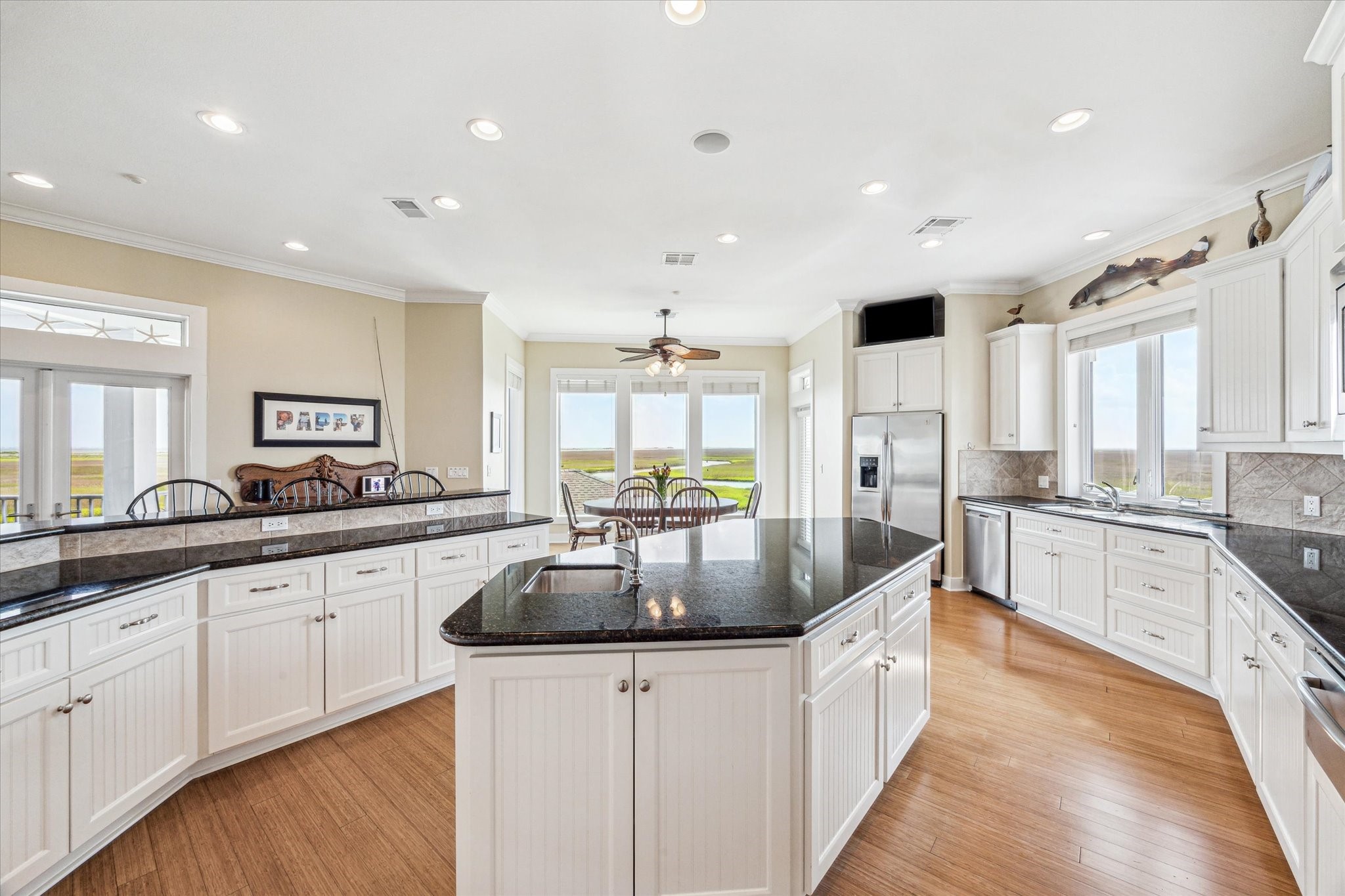 1 Shell Key Hitchcock, TX 77563 - Photo 18 of 50 a large kitchen with granite countertop a large counter top space a sink stainless steel appliances and cabinets