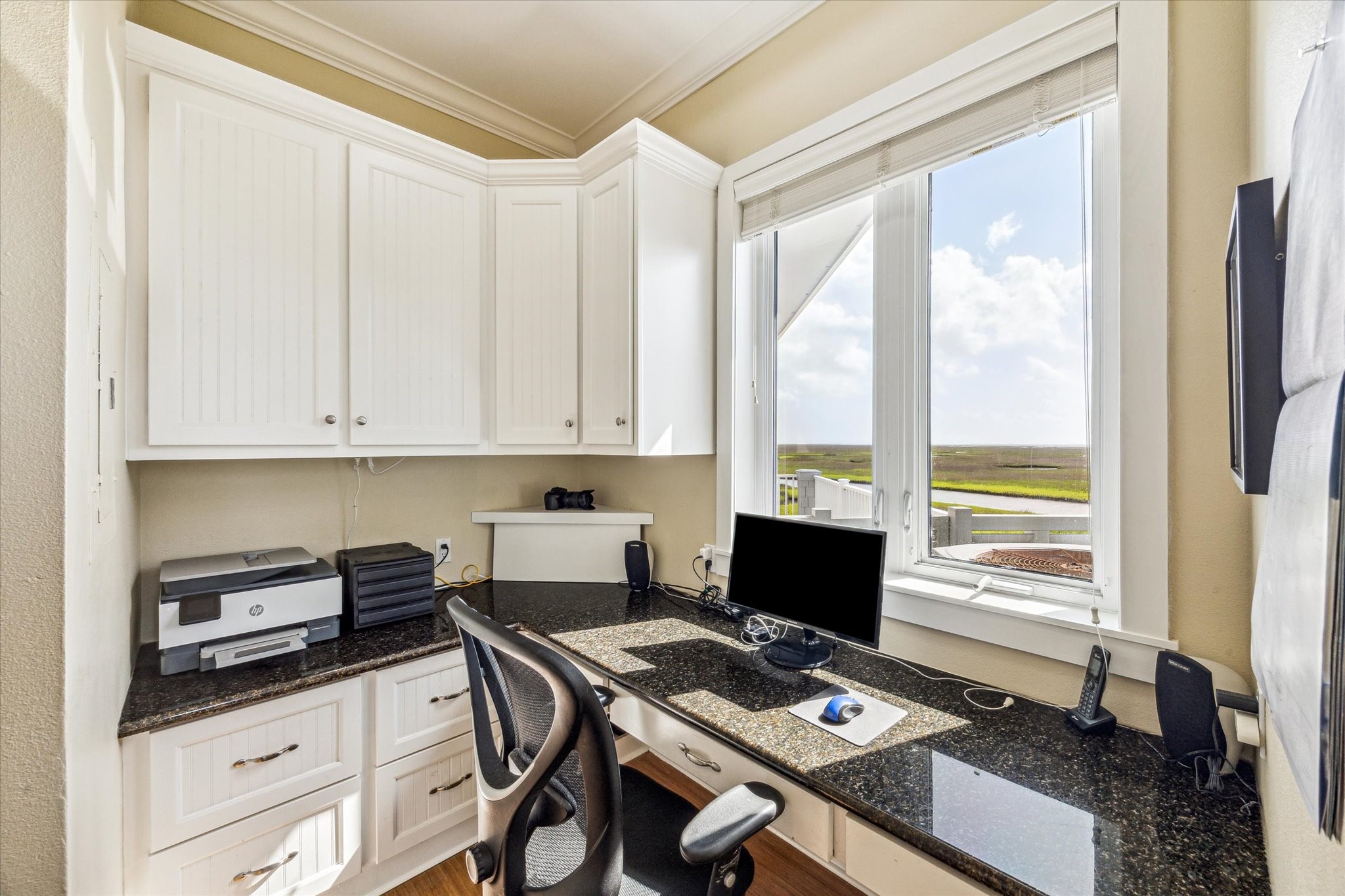 1 Shell Key Hitchcock, TX 77563 - Photo 22 of 50 a view of workspace with wooden floor windows cabinet and chair