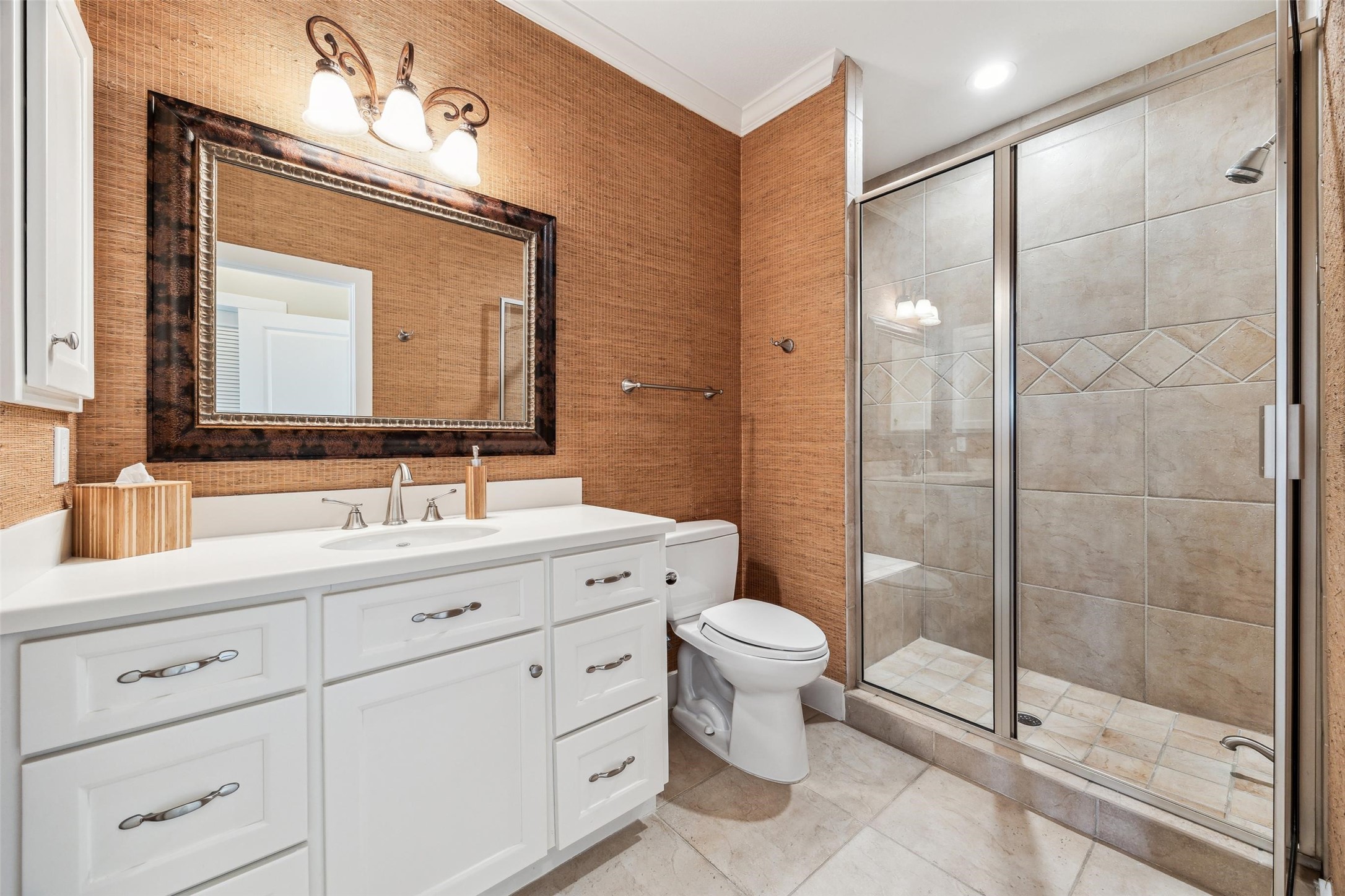 1 Shell Key Hitchcock, TX 77563 - Photo 34 of 50 a bathroom with a toilet a sink a glass door a shower a mirror a vanity and window