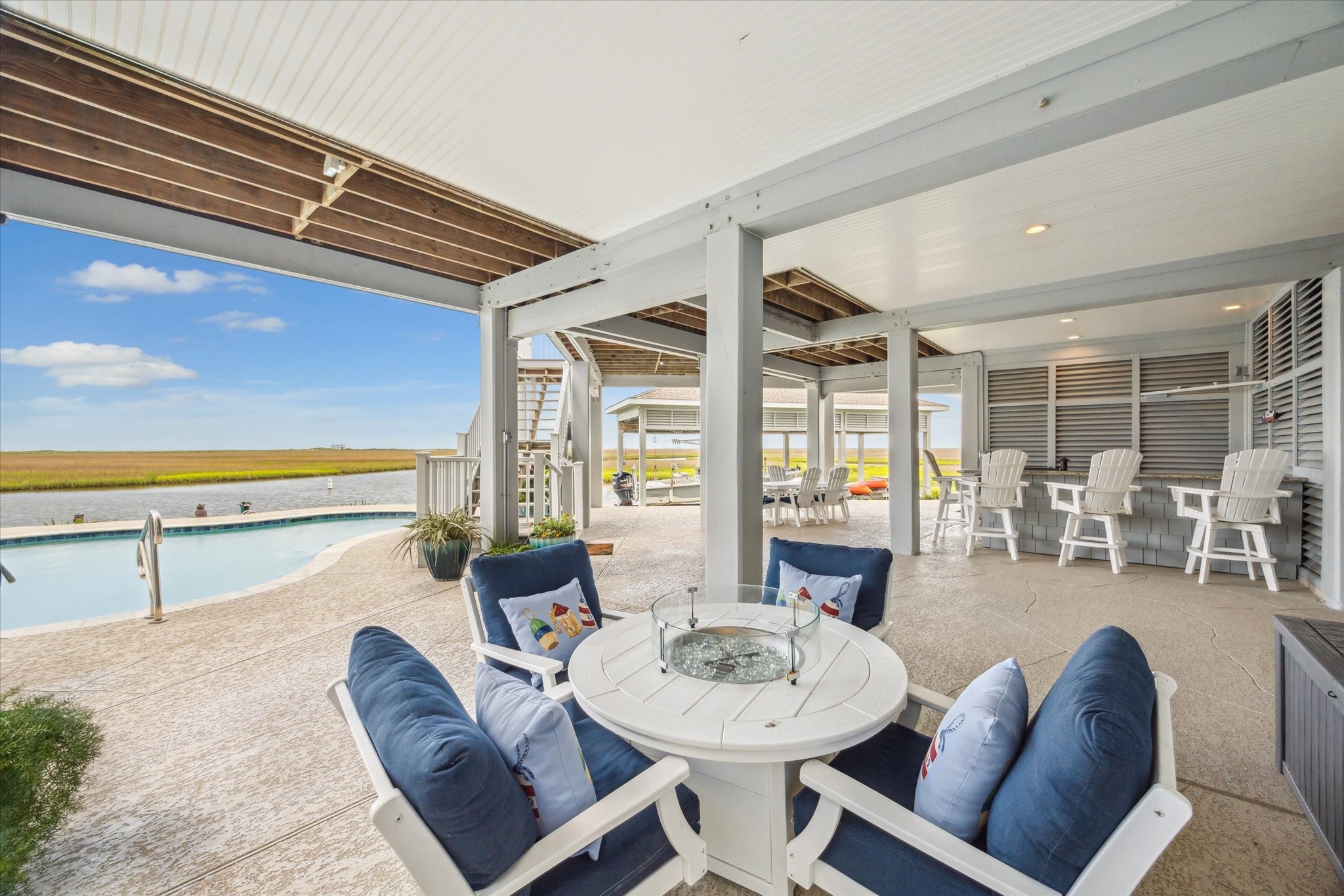 1 Shell Key Hitchcock, TX 77563 - Photo 44 of 50 Enjoy uninterrupted living with a powerful 26 kW Generac natural gas generator, a lightning protection system, and a new roof installed in June 2016 for long-term durability. A private elevator provides convenient access to all floors, while the newly finished epoxy garage flooring offers a clean, polished look with lasting performance. Whether you're relaxing indoors or enjoying the views outside, this home delivers a secure and elevated coastal lifestyle