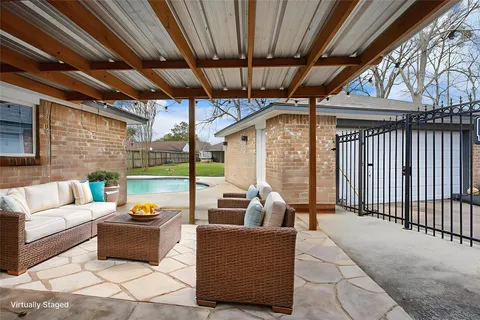 a view of a house with a yard and sitting area