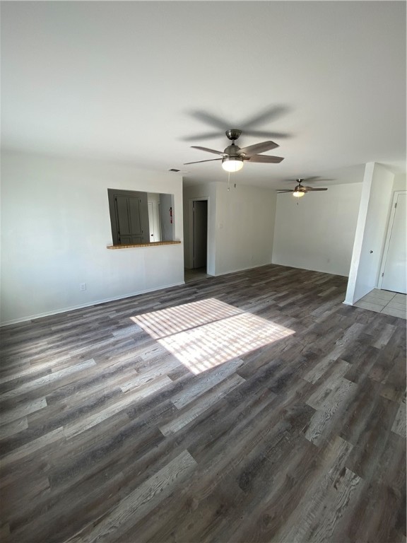 313 Easy Street, Unit A Corpus Christi, TX 78418 - Photo 4 of 16 a view of empty room with wooden floor and fan