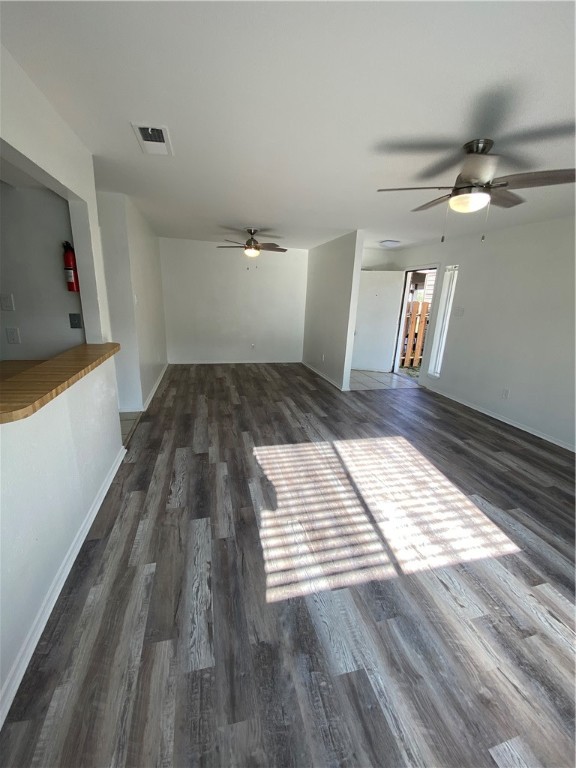313 Easy Street, Unit A Corpus Christi, TX 78418 - Photo 5 of 16 a view of wooden floor and a kitchen space