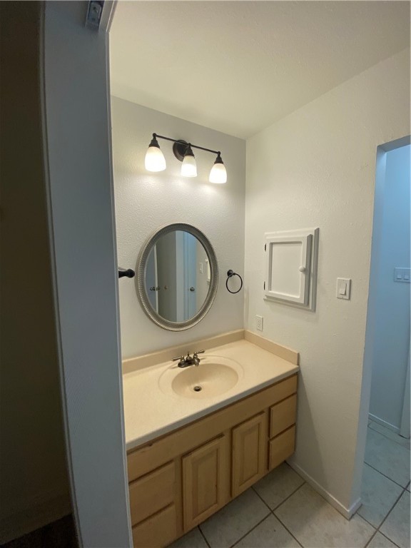 313 Easy Street, Unit A Corpus Christi, TX 78418 - Photo 9 of 16 a bathroom with a sink and a mirror