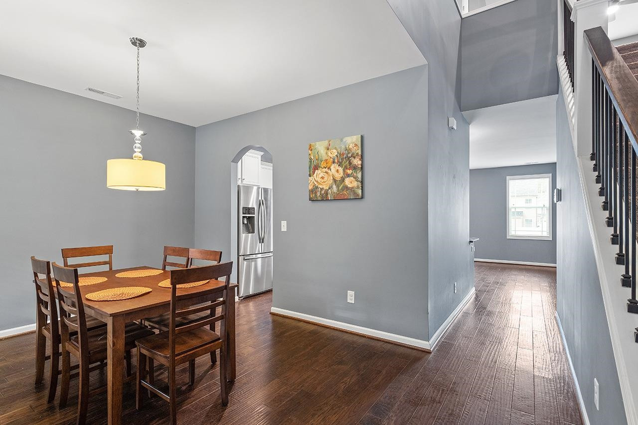 2929 Britmass Drive Raleigh, NC 27616 - Photo 15 of 35 a view of a dining room with furniture and wooden floor
