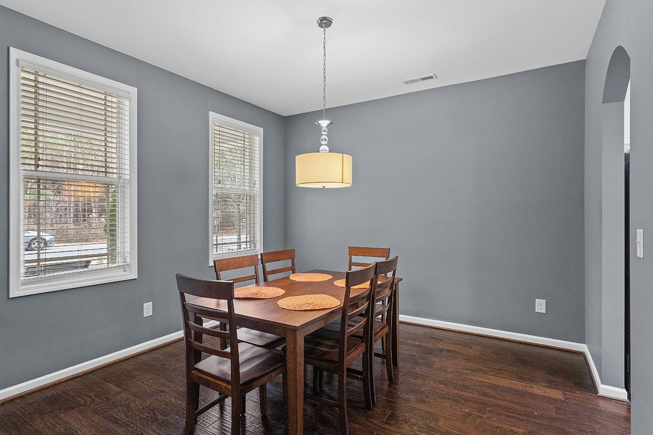 2929 Britmass Drive Raleigh, NC 27616 - Photo 16 of 35 a view of a dining room with furniture window and wooden floor