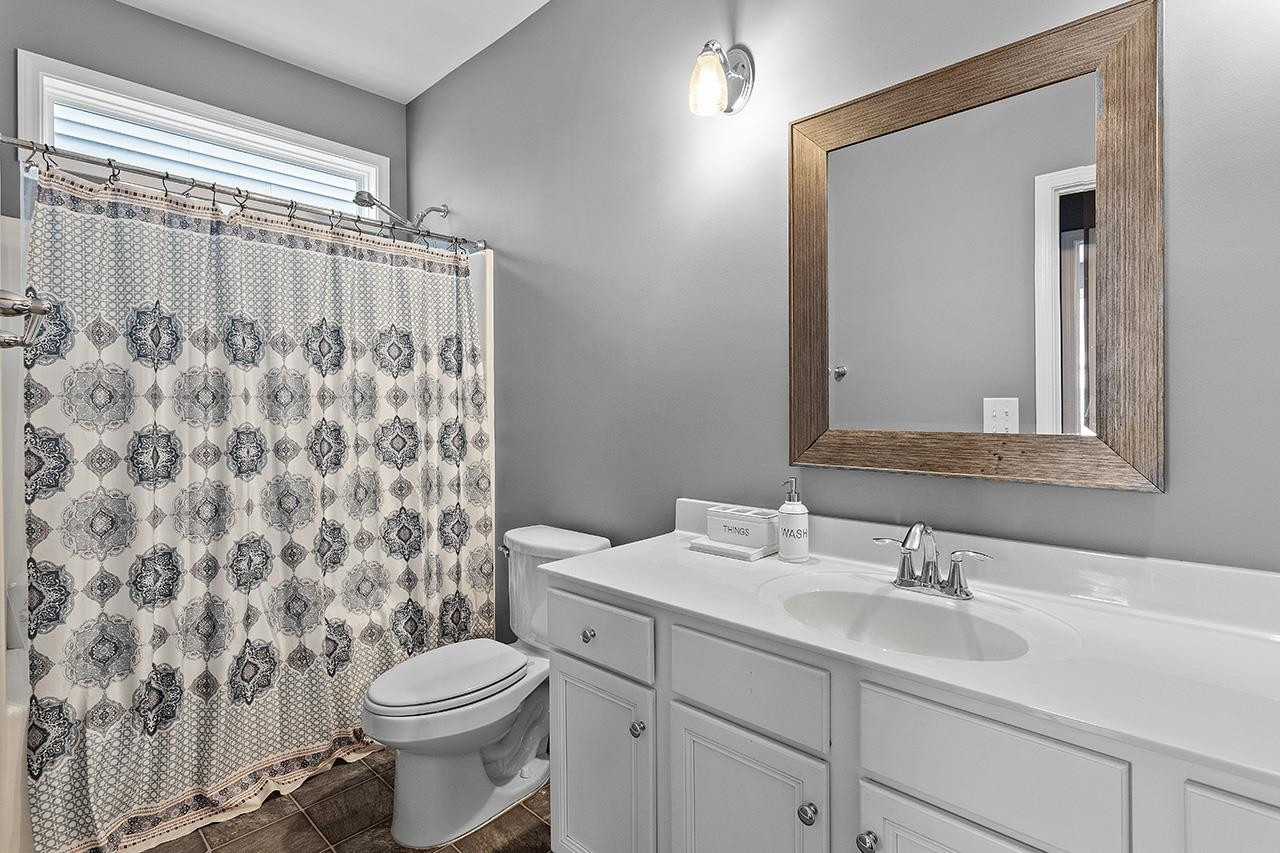 2929 Britmass Drive Raleigh, NC 27616 - Photo 18 of 35 a bathroom with a sink toilet and shower