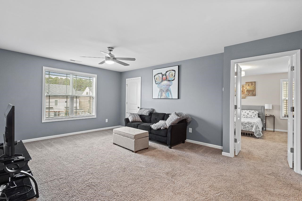 2929 Britmass Drive Raleigh, NC 27616 - Photo 19 of 35 a living room with furniture and a window