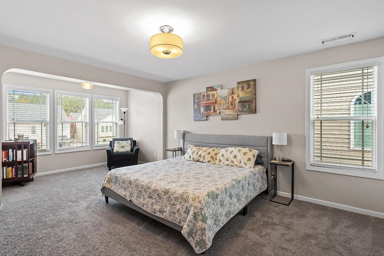 2929 Britmass Drive Raleigh, NC 27616 - Photo 22 of 35 a bedroom with a bed and a window