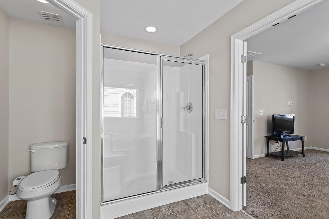 2929 Britmass Drive Raleigh, NC 27616 - Photo 26 of 35 a bathroom with a toilet and a shower