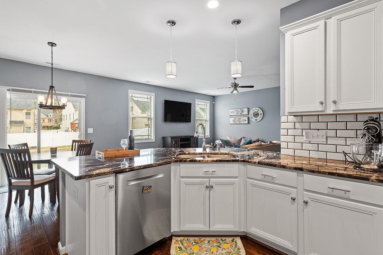 2929 Britmass Drive Raleigh, NC 27616 - Photo 6 of 35 a kitchen with a sink stove and cabinets