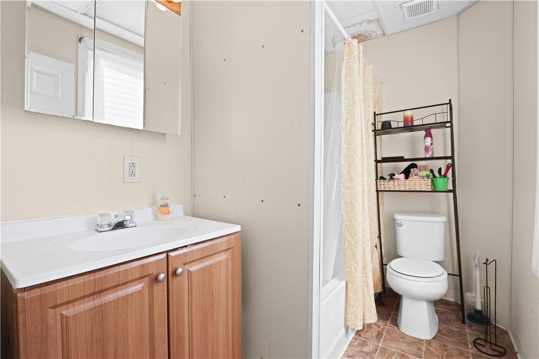 431 Pierce Street Bethlehem, PA 18015 - Photo 16 of 27 Compact and practical, this bathroom features a bright vanity and a shower-tub combination.