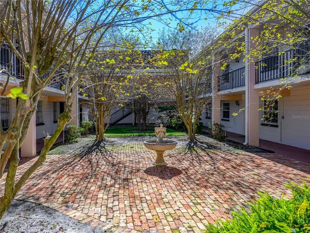 a view of a building with a yard