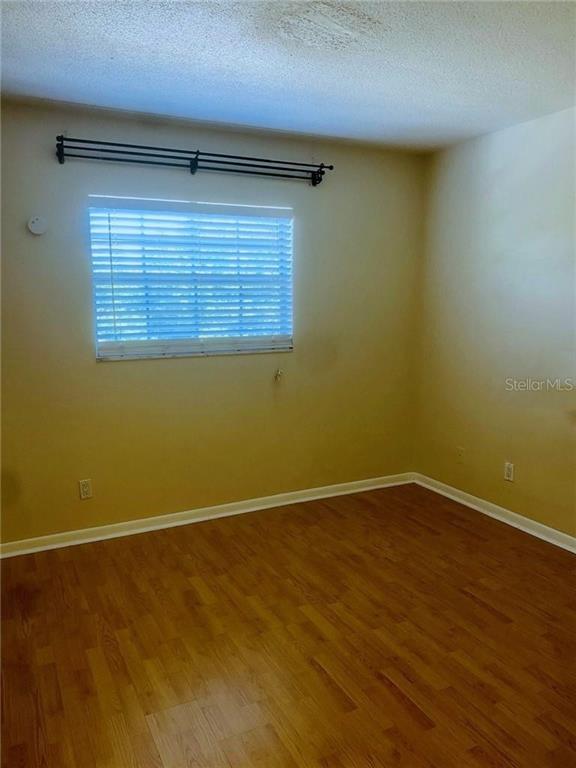 120 South Church Avenue, Unit 209 Tampa, FL 33609 - Photo 6 of 11 a view of an empty room with a window