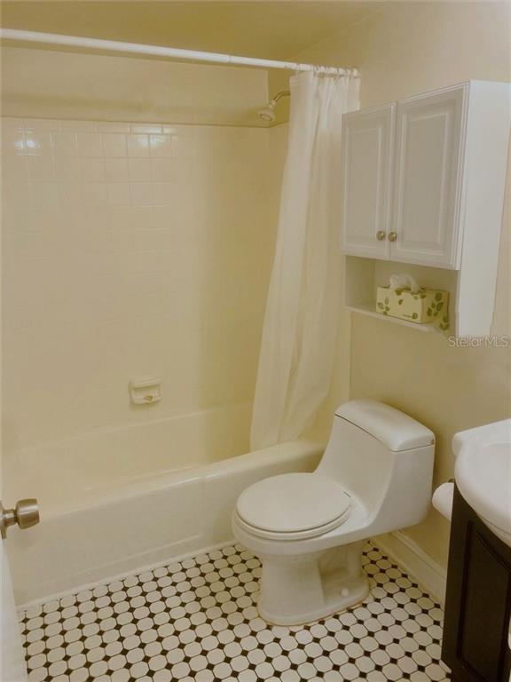 120 South Church Avenue, Unit 209 Tampa, FL 33609 - Photo 9 of 11 a white toilet sitting next to a bathroom sink