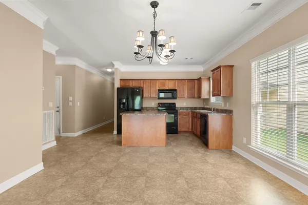 a view of a kitchen with a sink stainless steel appliances and cabinets