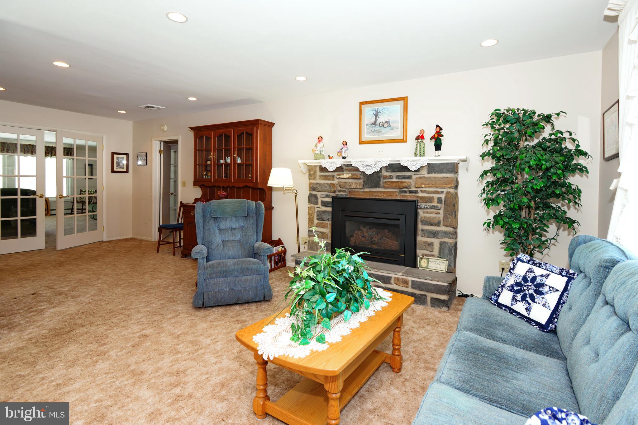 485 Quarry Road Harleysville, PA 19438 - Photo 14 of 37 Living Room Stone Fireplace with Propane Insert