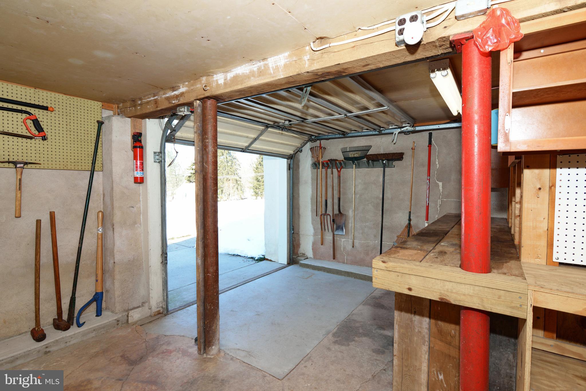 485 Quarry Road Harleysville, PA 19438 - Photo 33 of 37 Basement Storage Area with Garage Door