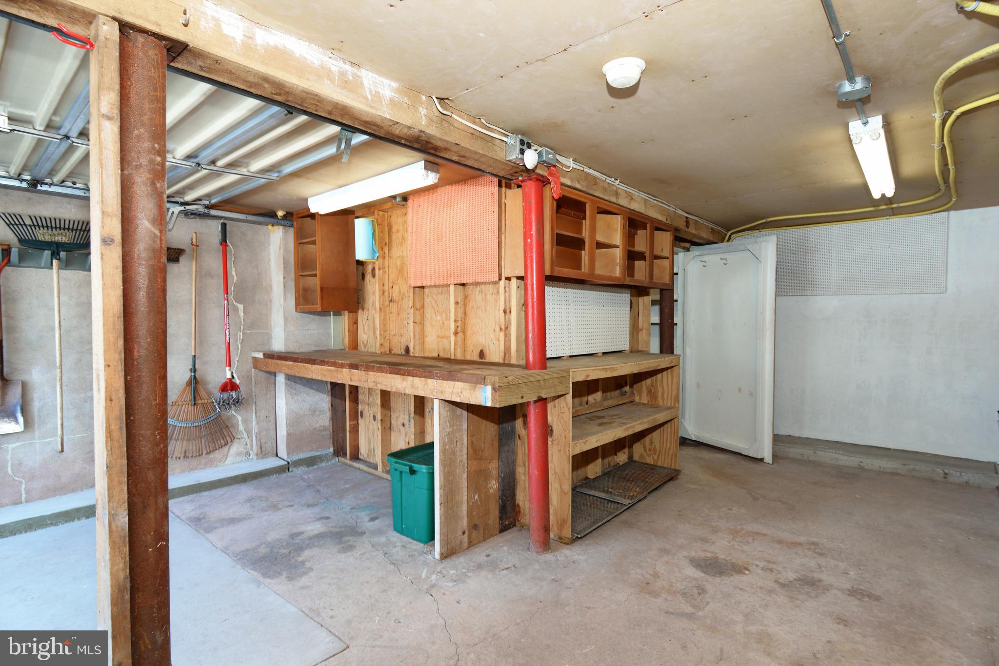 485 Quarry Road Harleysville, PA 19438 - Photo 34 of 37 Basement Storage Area with Garage Door