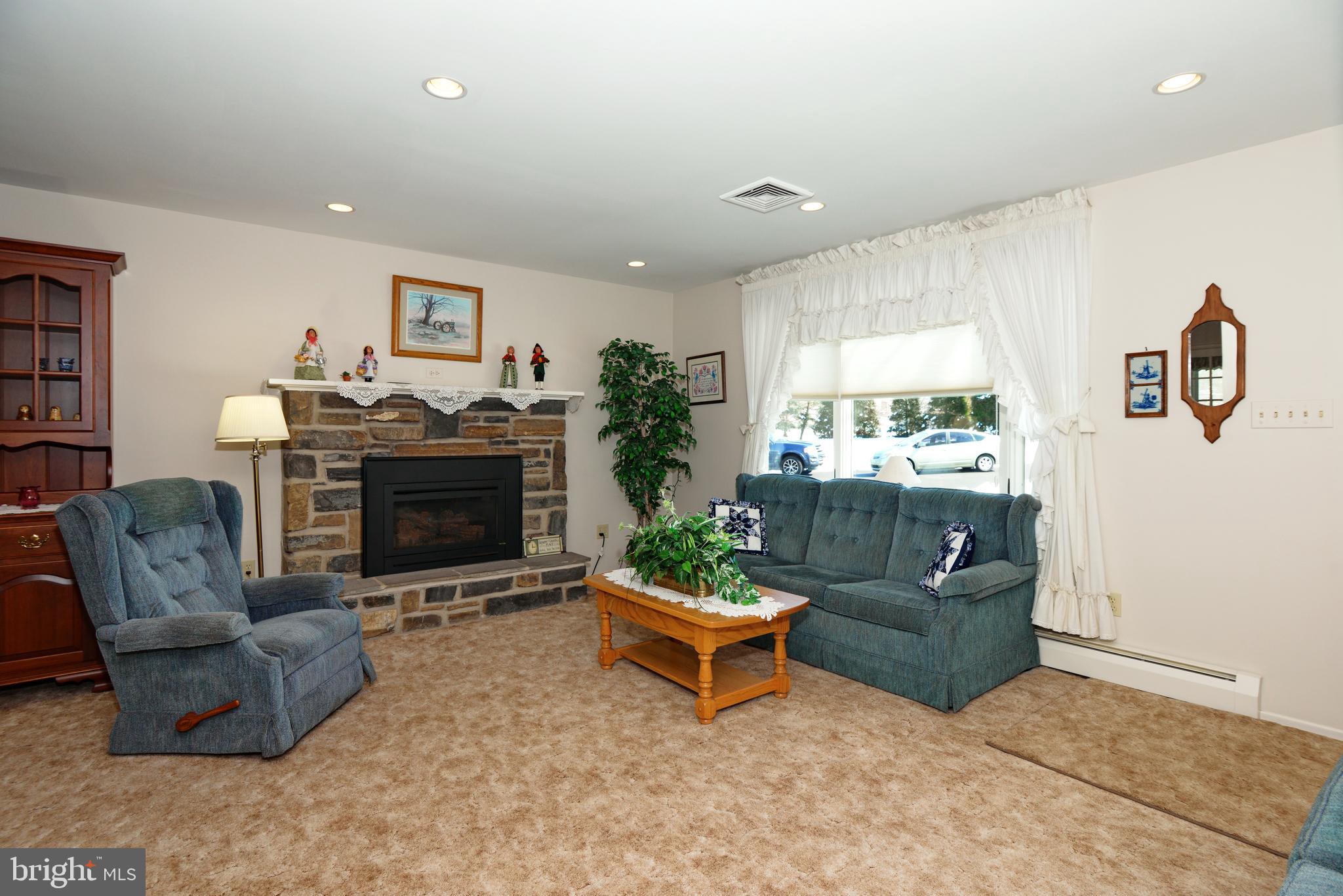 485 Quarry Road Harleysville, PA 19438 - Photo 6 of 37 Living Room Stone Fireplace with Propane Insert