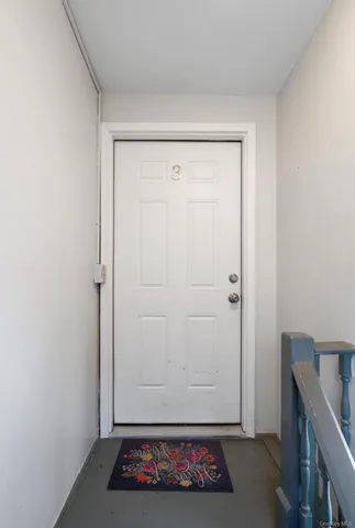 view of room with closet and wooden floor