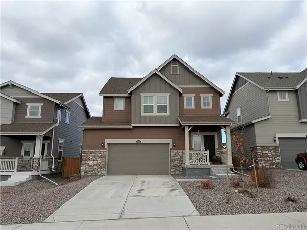 a front view of a house with yard