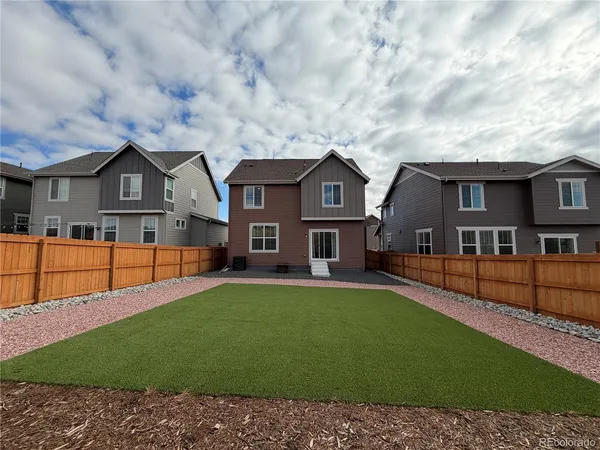 a front view of a house with yard