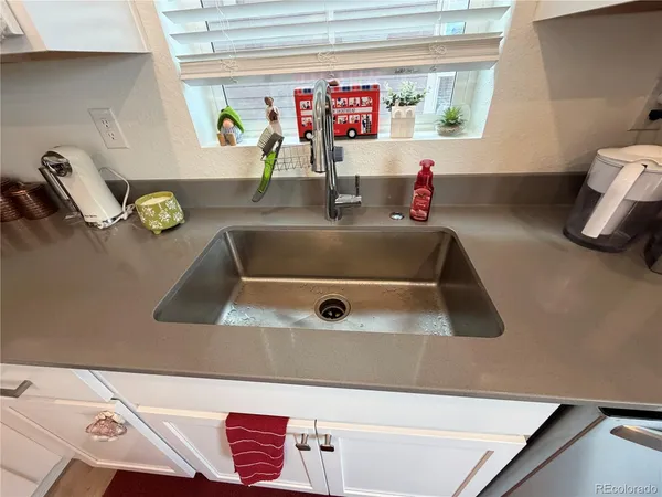 a bathroom with a sink and mirror