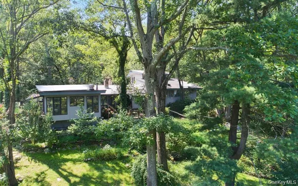 a view of a house with a tree