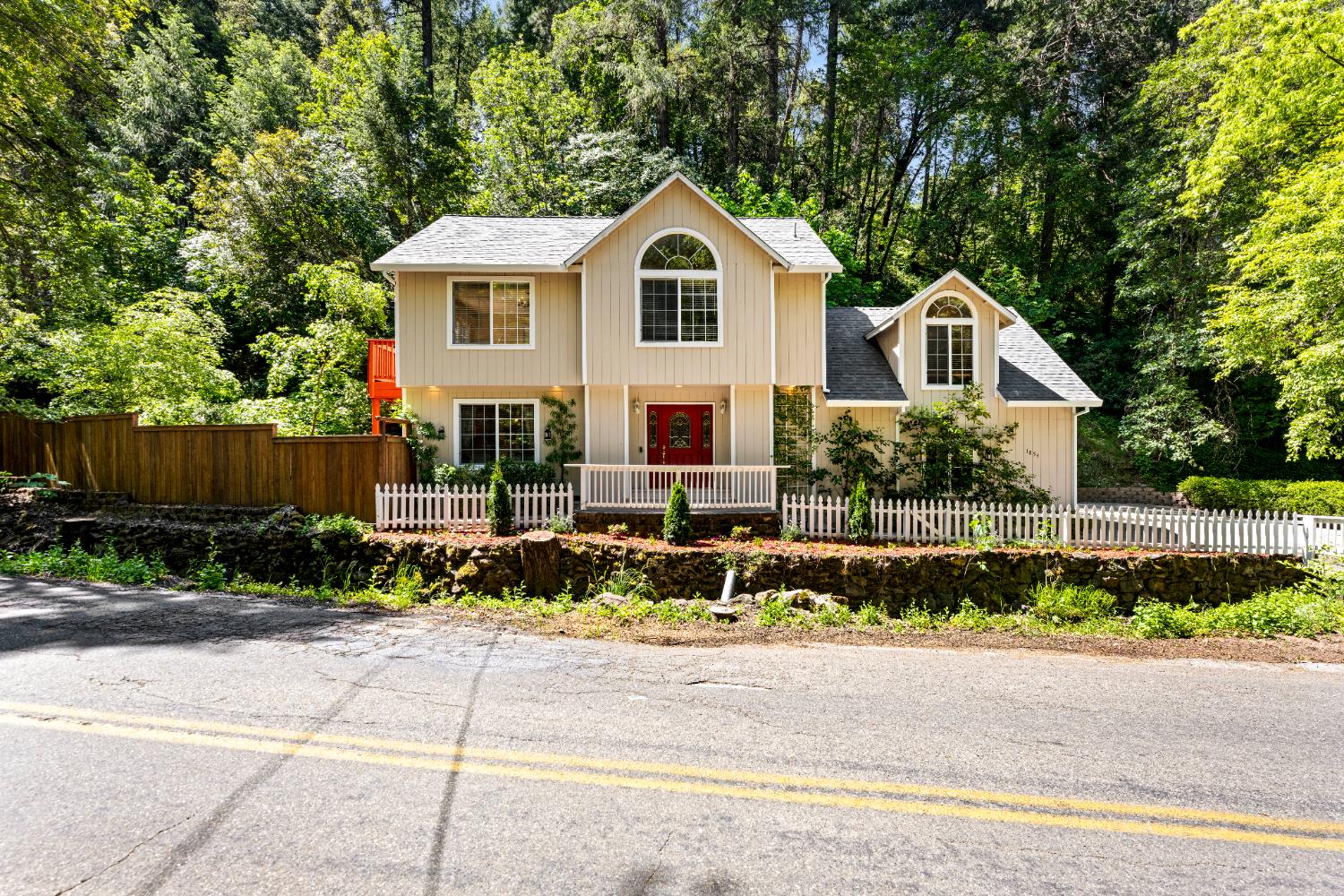 1854 Smith Flat Road Placerville, CA 95667 - Photo 1 of 1 a front view of a house with a yard and a garage
