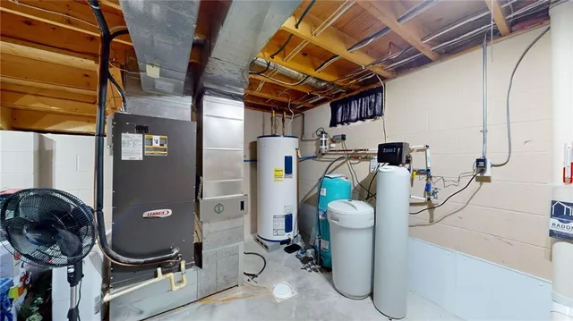 a storage room with water heater and racks