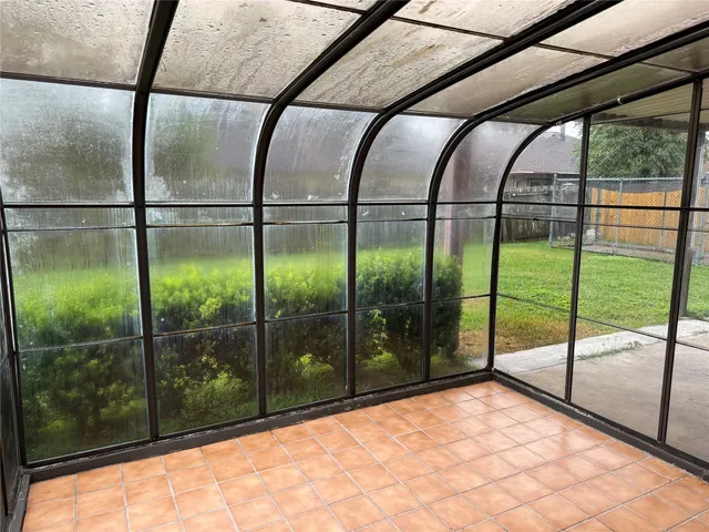 a view of outdoor space with a backyard of windows