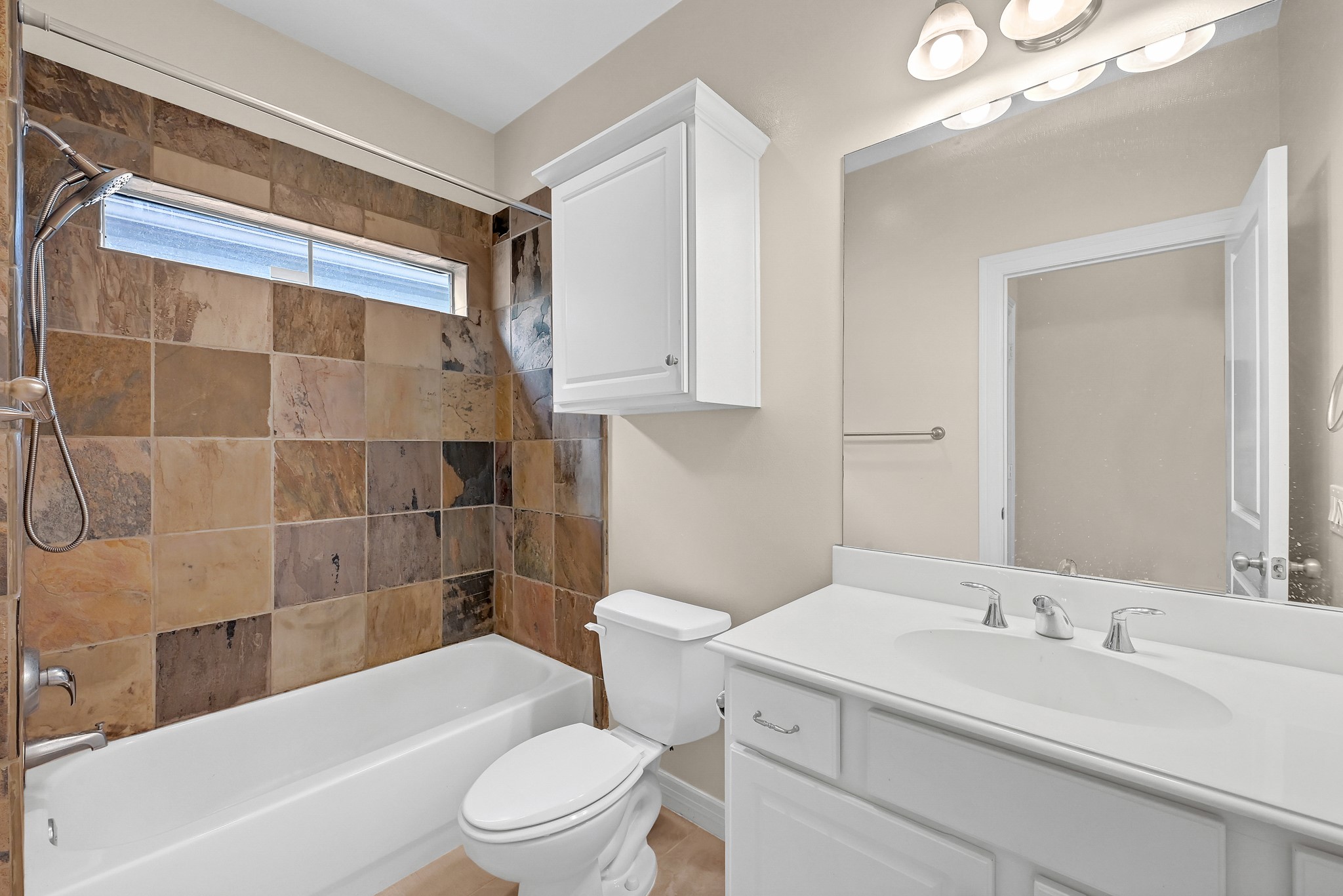 1204 Cohn Street Houston, TX 77007 - Photo 5 of 25 a bathroom with a sink a toilet and shower