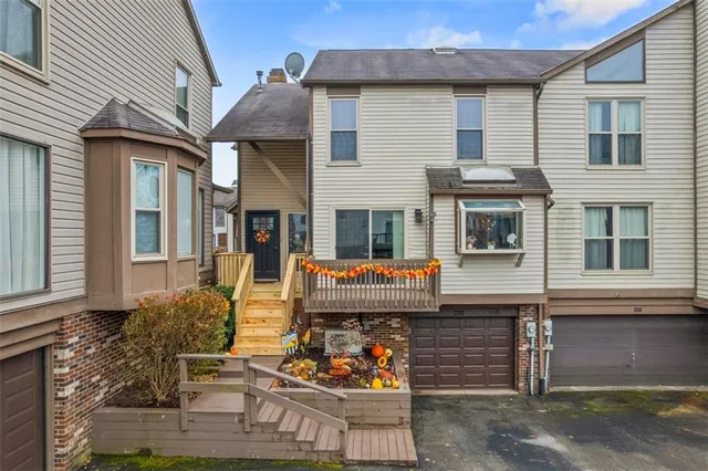 a front view of a house with large windows