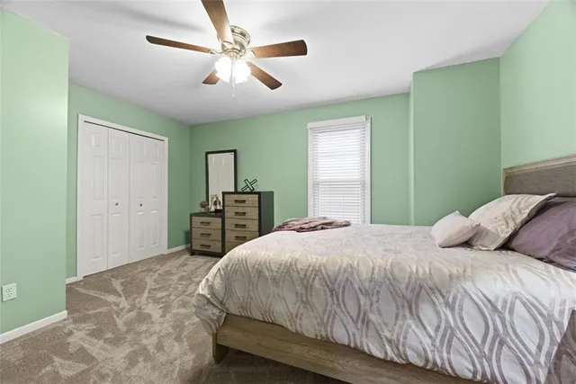 an aerial view of a house with a lake