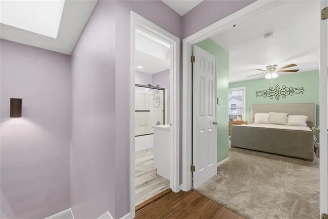 a bathroom with a tub shower and vanity